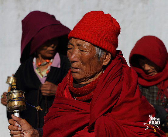 An Elderly Bhutanese Woman offering prayers at Thimphu, Bhutan