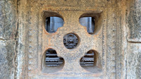Beautiful view of the exquisite bas reliefs and sculptures from a window at Bhaktavatsala Perumal Temple, Cheranmahadevi