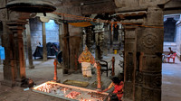 Lighting lamps in front of Garuda at Nindra Nambi Perumal temple, Thirukkurungudi