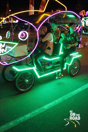 Locals enjoy a ride in dazzling cycle carts at Jogja, Indonesia