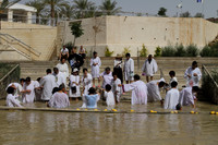 Pilgrims getting baptized at Bethany on the Israel side of the Jordan river