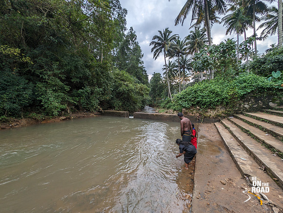 Devotees at the river behind the Aryankavu Saastha Temple, Kerala