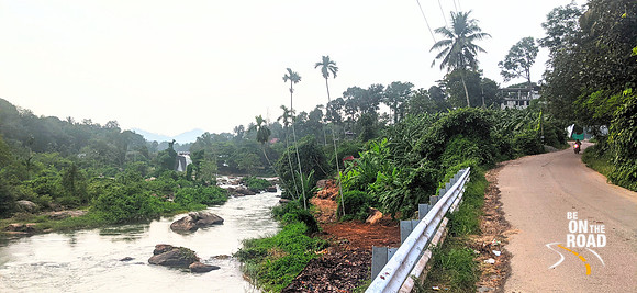 Thiruparappu Falls and the Kodayar river seen from the highway