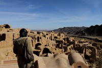 Admiring the abandoned mud city of Kharanaq in Iran