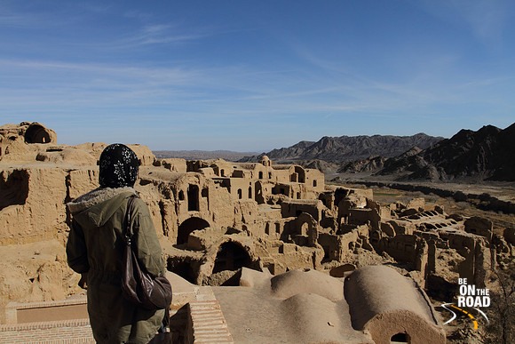 Admiring the abandoned mud city of Kharanaq in Iran