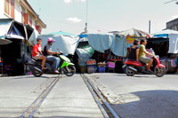 Looking at the Mae Klong Railway Market, Thailand