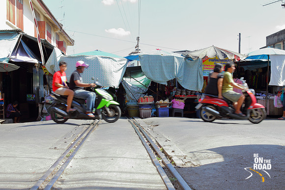 Looking at the Mae Klong Railway Market, Thailand