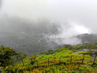 Views slowly clearing during monsoon season at Bisle View Point, Karnataka