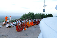 Buddhist monks offering a prayer next to the stupa at Mihinthale, Srilanka