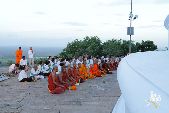Buddhist monks offering a prayer next to the stupa at Mihinthale, Srilanka