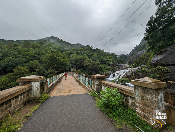 Manimuthar Falls, the lush green forest and the cloudy monsoon weather