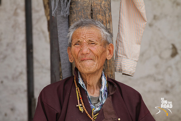 The creases on the face of an elderly Ladakhi man at Shey Palace, Ladakh, India