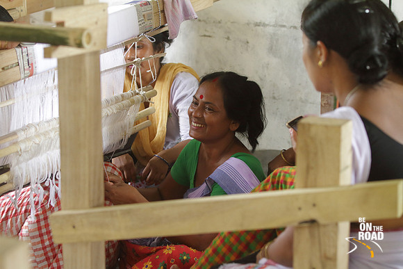 Mishing tribal women and their traditional looms, Assam