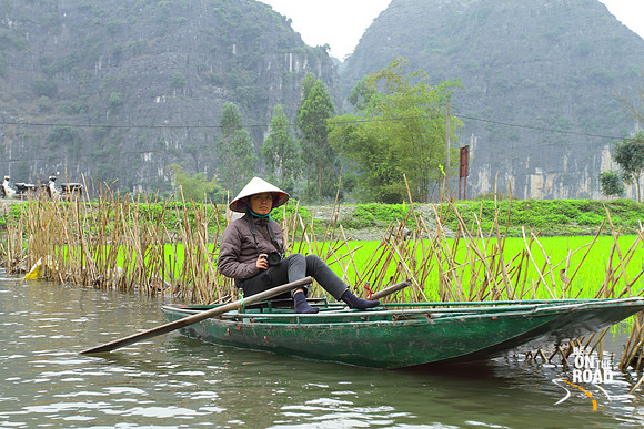 Local photographer Vietnamese lady and her boat, Ninh Binh, Vietnam