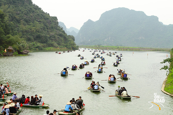 Maze of boats get ready to explore the caves around the Tam Coc river, Vietnam