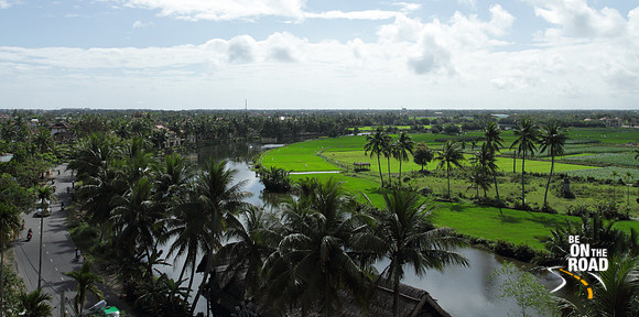 Thu Bon River flows through lush green paddy fields of Hoi An, Vietnam
