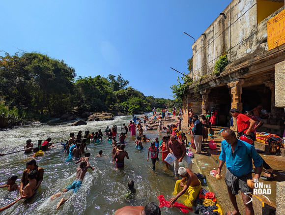 Bathing in the Thamirabharani river at the holy town of Papanasam, Tamil Nadu