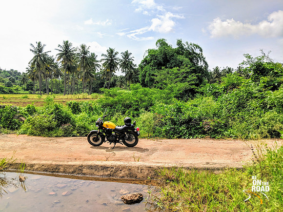 My Custom Royal Enfield Motorcycle posing amidst gorgeous rural surroundings of Karnataka
