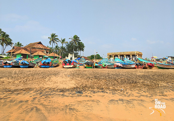 Colourful boats and old buildings at Shangumugham Beach