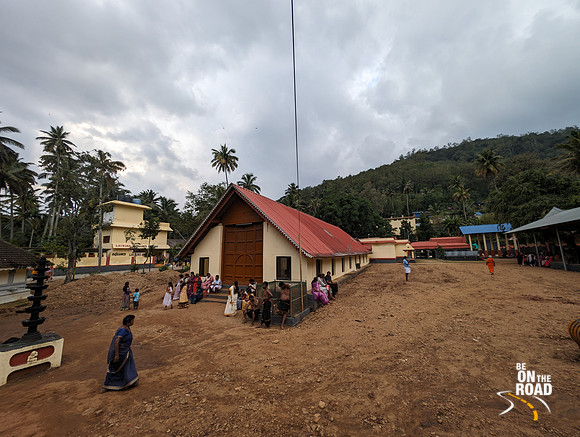 Aryankavu Saastha Temple surrounded by lush greenery