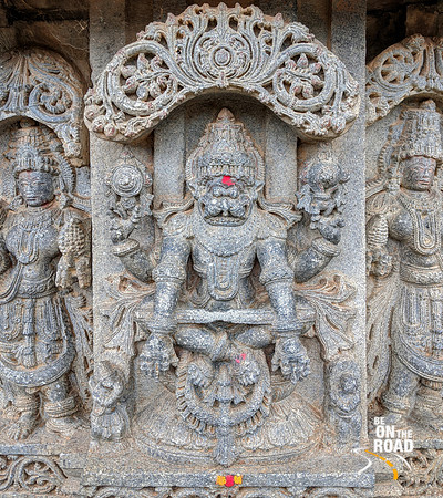 Yoganarasimha with two consorts and Garuda and Prahalada below - Lakshmi Narasimha Temple, Nuggehalli