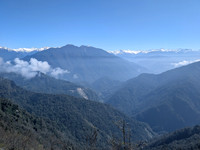 Winding roads and snow capped peaks as seen from Mayodia pass, Arunachal Pradesh