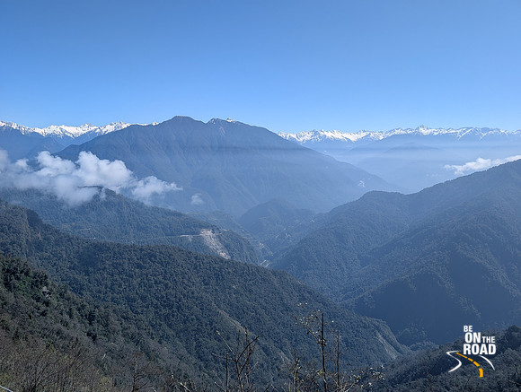 Winding roads and snow capped peaks as seen from Mayodia pass, Arunachal Pradesh