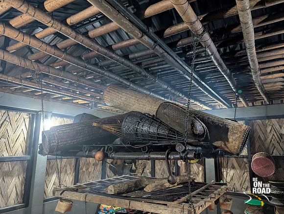 Mats and fishing gear stored above the fireplace at Galo dining area in Aalo homestay