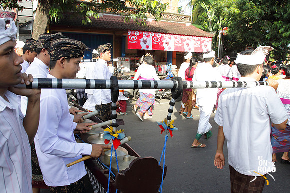 Balinese men play music during a procession at Ubud, Indonesia