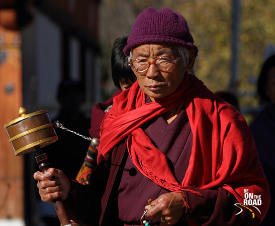 Old man from Bhutan offering prayers