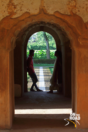 A couple next to the ancient walls of Rang Ghar, Sibsagar, India