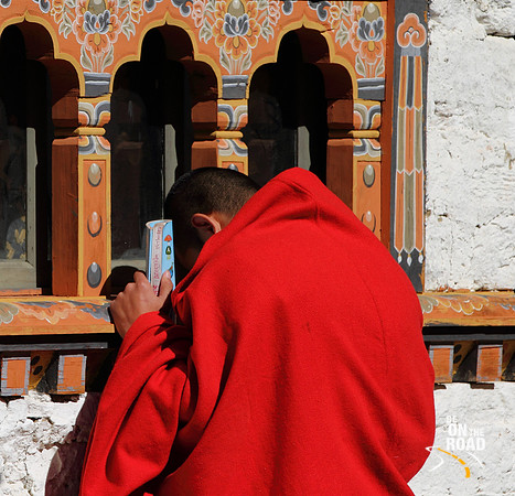Monk prays at Simtokha Dzong, Bhutan