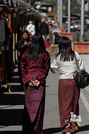 Bhutanese Women enjoy the winter sun during a stroll in Thimphu, Bhutan